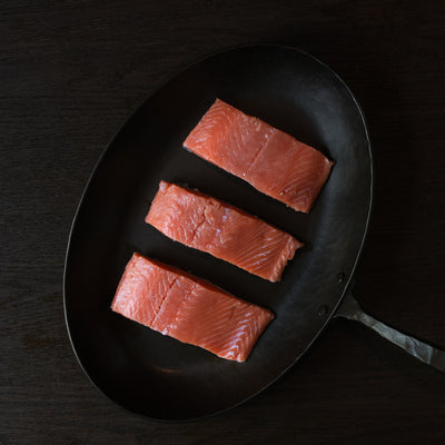 King salmon portions in a pan